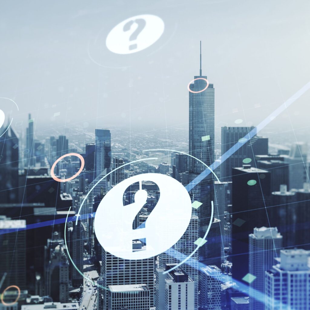 Illustration of multiple buildings with question marks above them, symbolizing questions about choosing the right building automation and energy management solutions (Authorized)